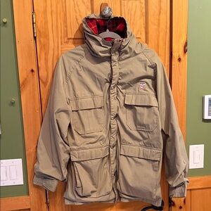 Vintage Woolrich Tan Hooded Jacket with Red Plaid Lining from 1984 Yugo Ski Team